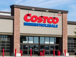 The facade of a Costco Wholesale store with its logo prominently displayed