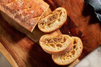 Sliced loaf of bread with a sausage filling