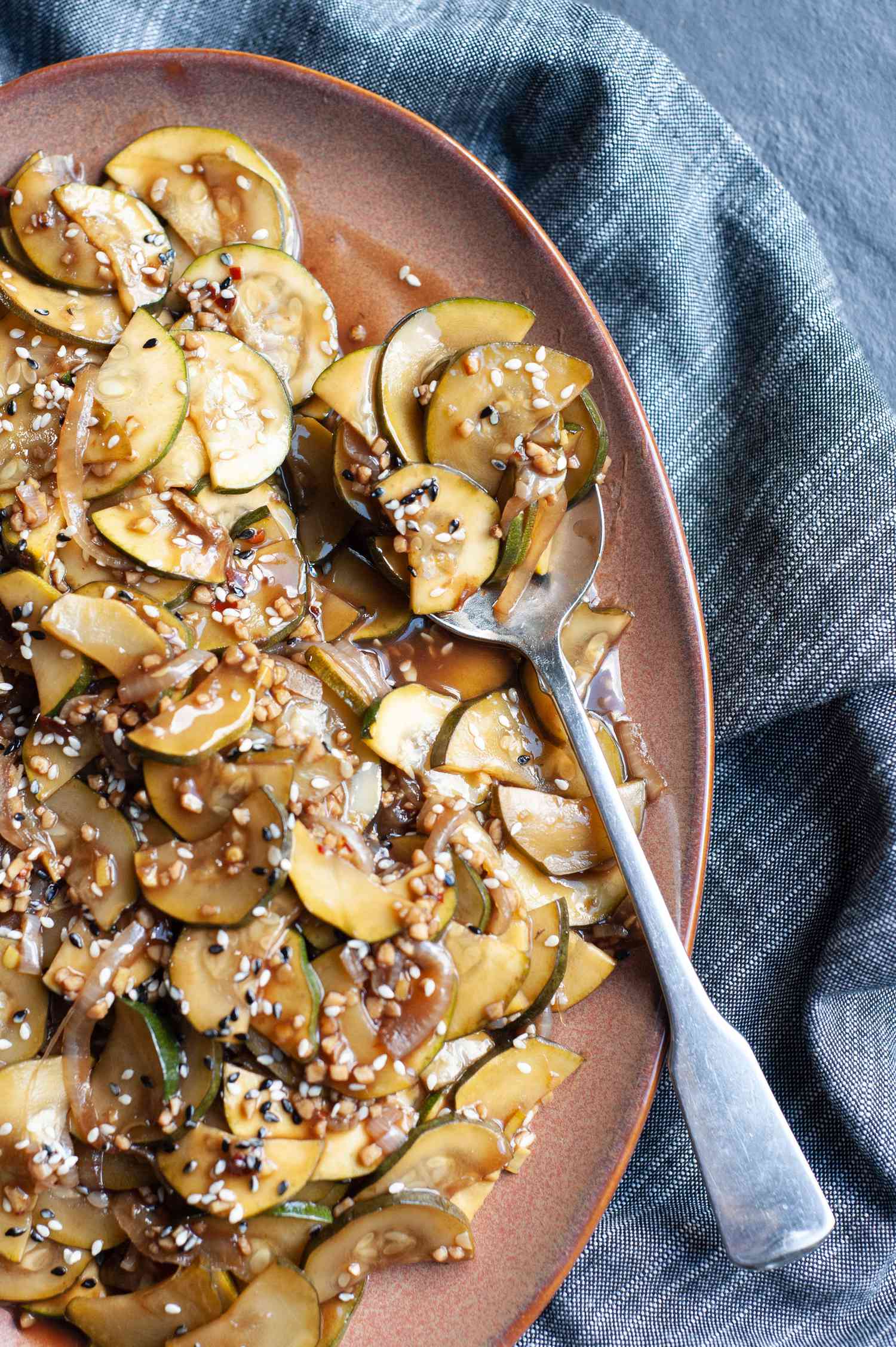 Zucchini Stir-Fry on a Platter with a Spoon