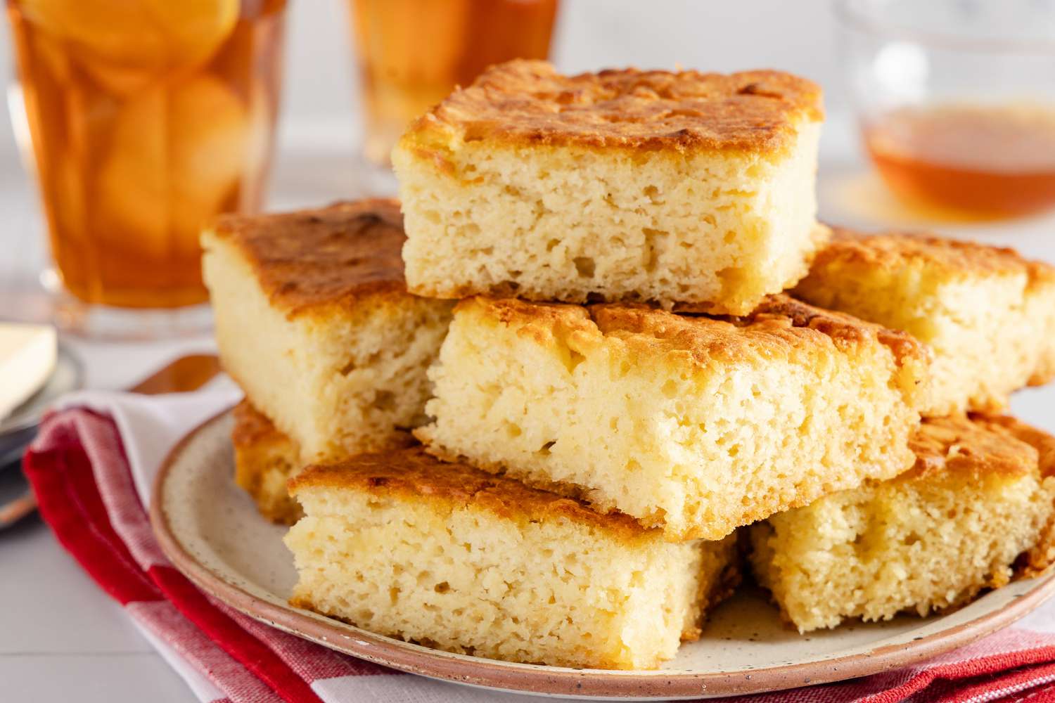 butter swim biscuits stacked on a plate