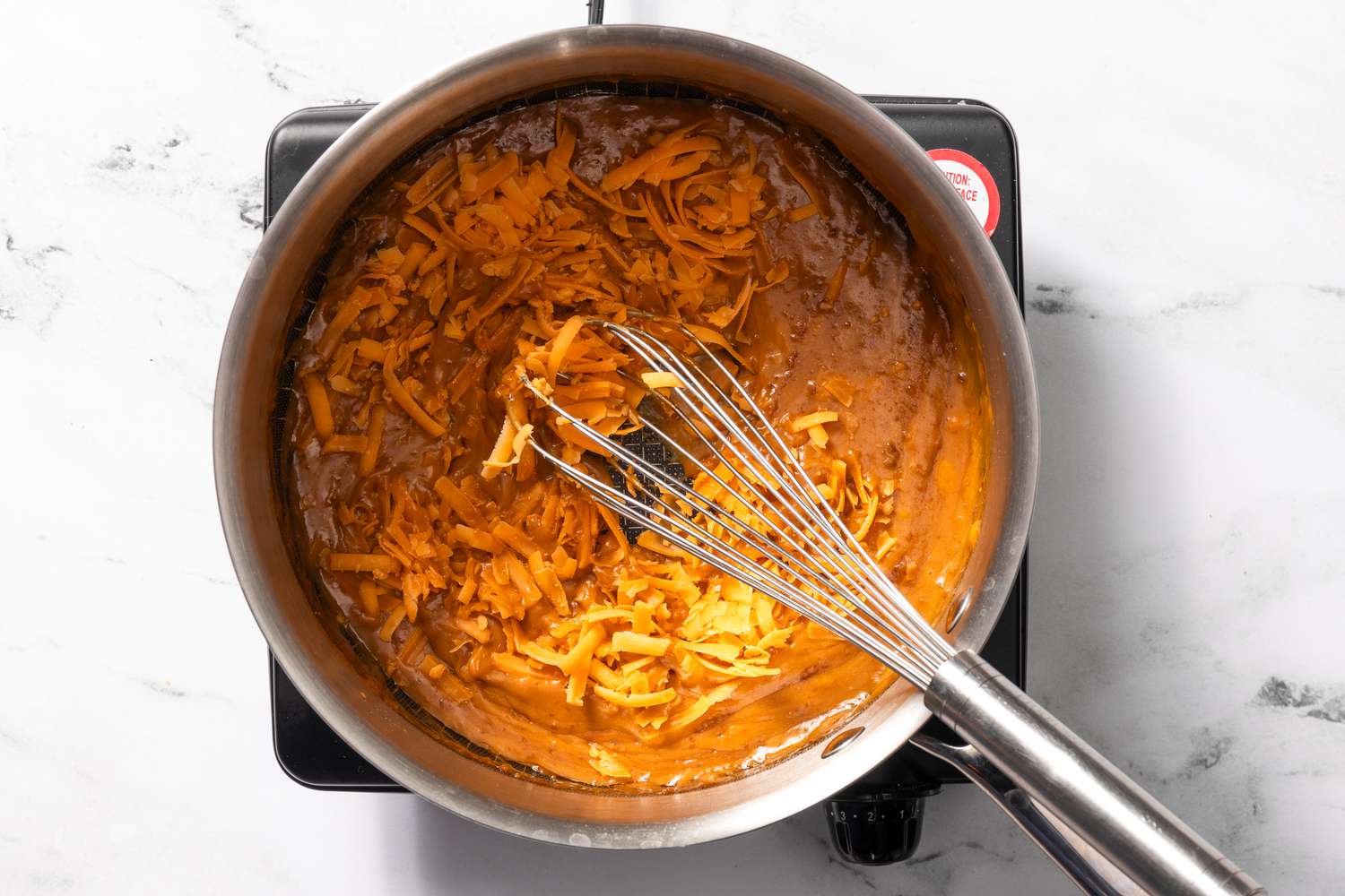 More cheese whisked into the welsh rarebit sauce recipe