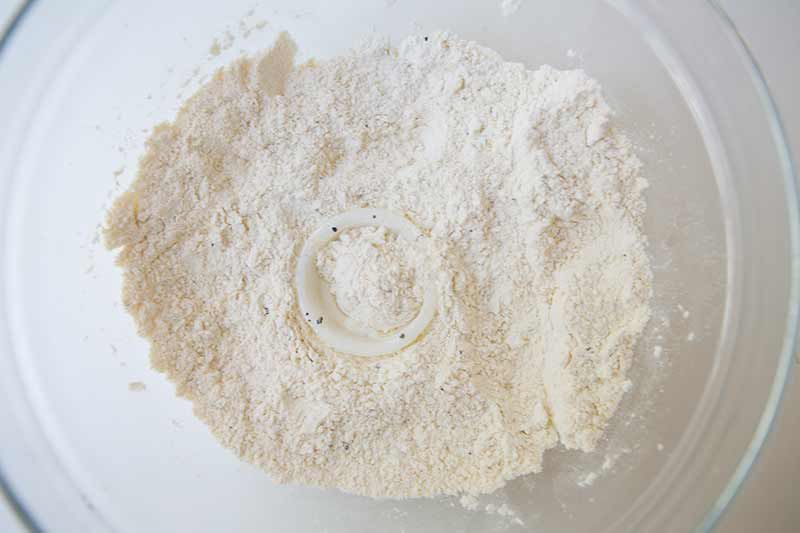 dredging onion rings in flour mixture