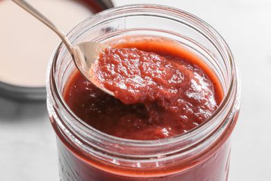 Spoonful of Banana Ketchup Lifted from Jar 