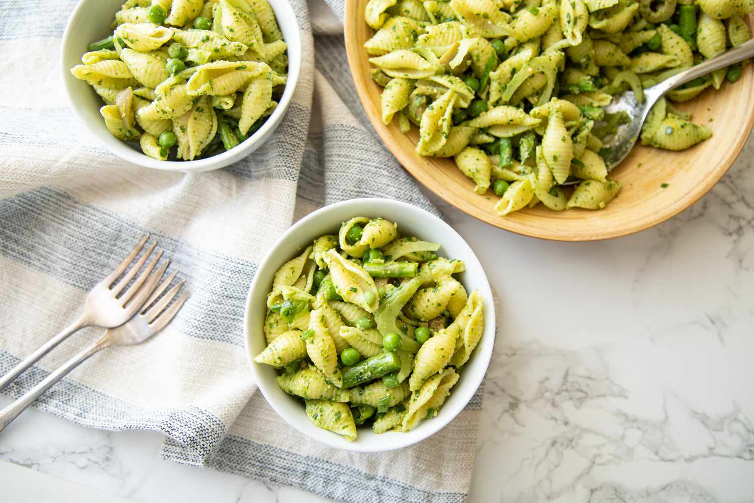 Bowl of Green Goddess Pasta Salad with a Bigger Bowl in the Background