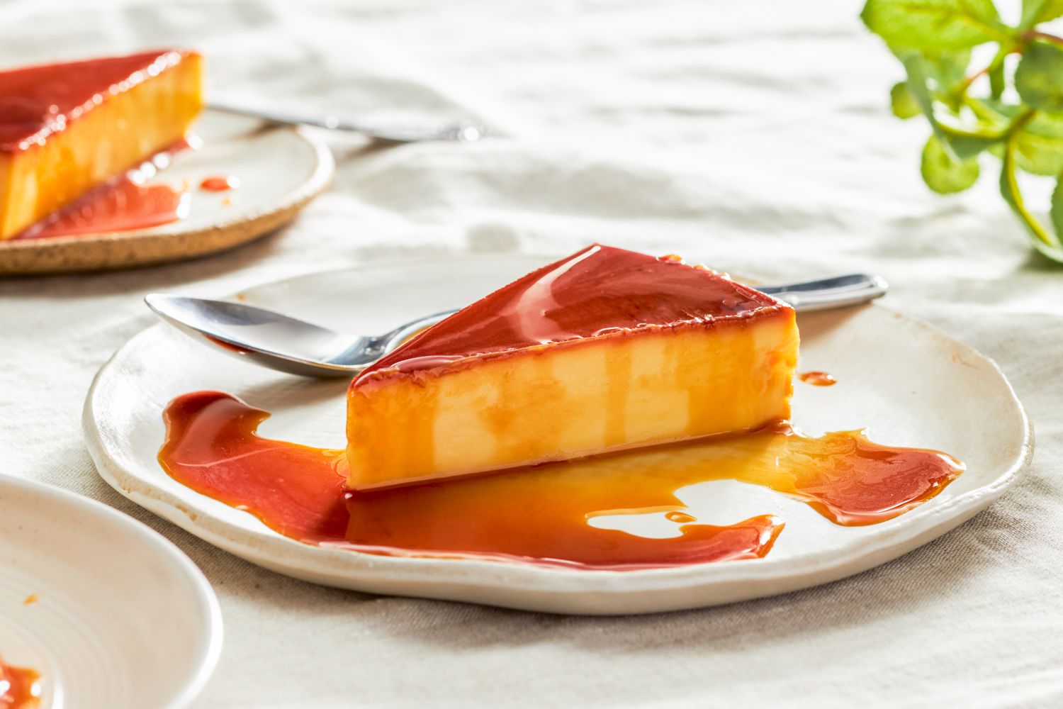 A wedge of flan on a plate