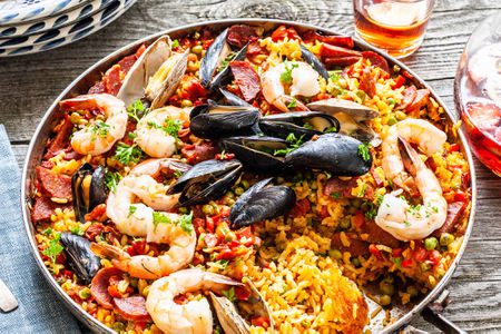 Finished seafood paella from the grill in a skillet ready to serve