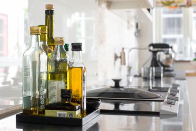 different types of olive oil on the counter 