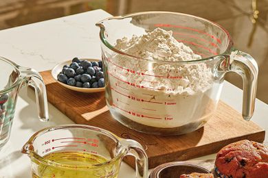 Measuring cup on a cutting board