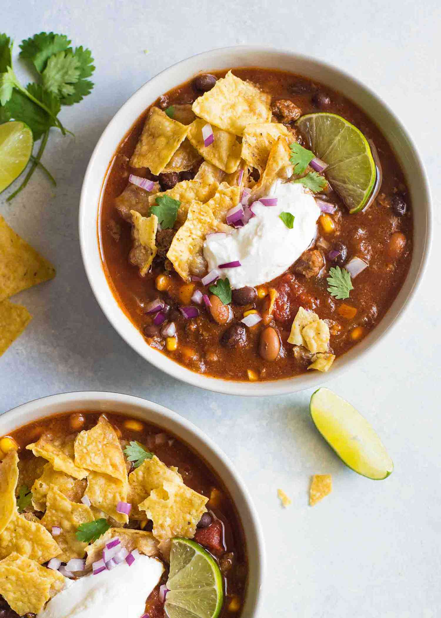 Easy Taco Soup in Bowl with Chips and Sour Cream