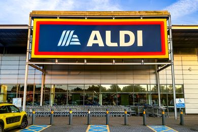 Entrance of an Aldi supermarket with shopping carts visible outside