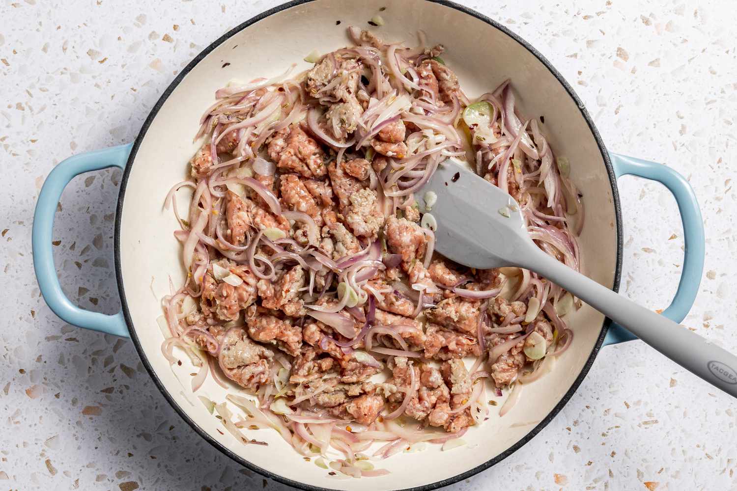 Spicy Italian Sausage Added to Pot With Onions and Garlic for Paccheri With Quick Sausage Ragu Recipe