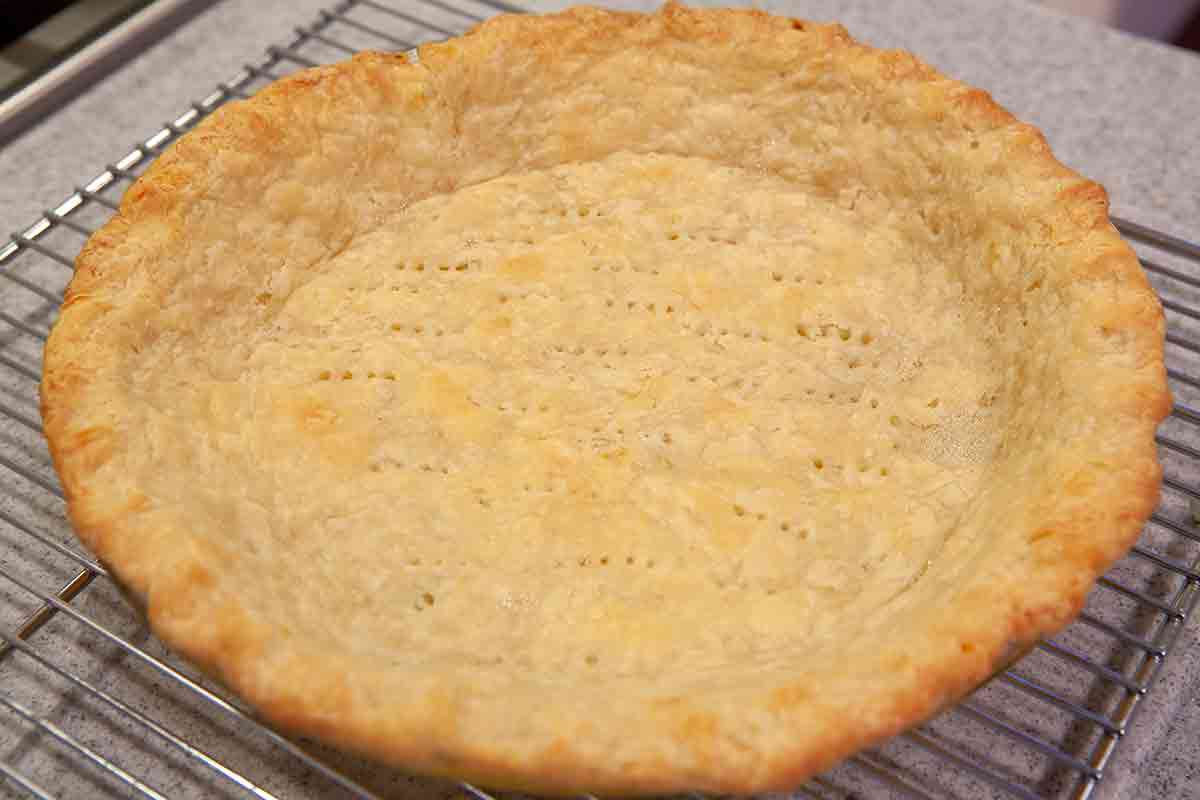 finish blind baking pie crust for the rhubarb meringue pie