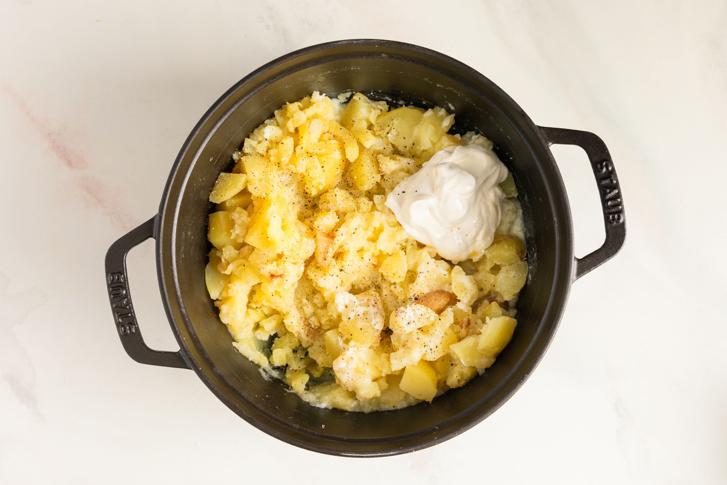 Sour cream and seasoning added to the mashed potatoes