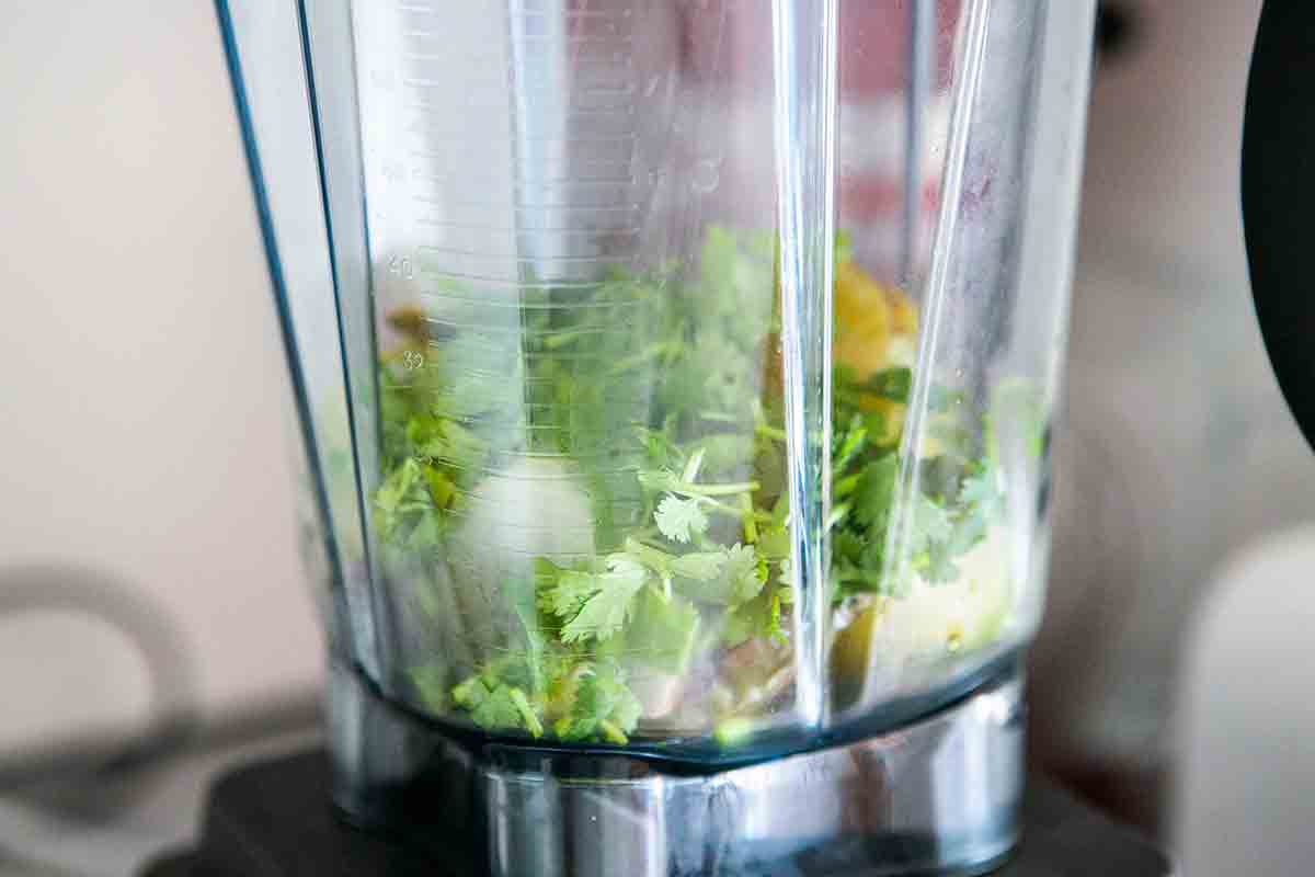 roasted tomatillos and cilantro in blender