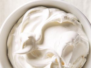 A bowl of whipped cream with a smooth texture