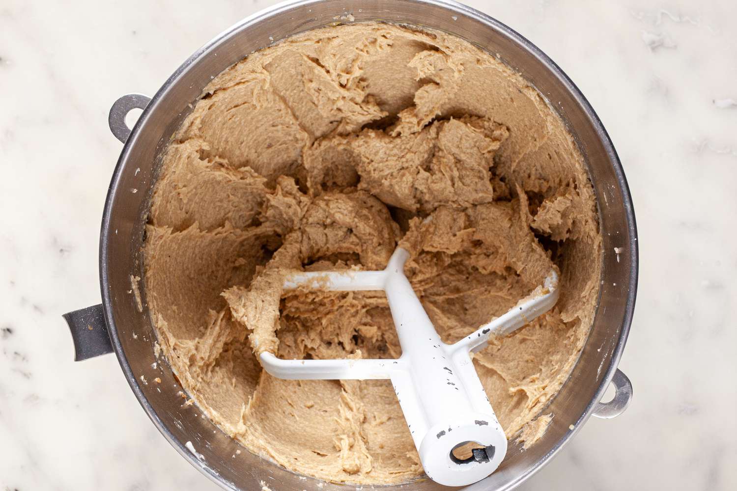 Creamed butter and sugar in a mixing bowl for a Cowboy Cookies recipe