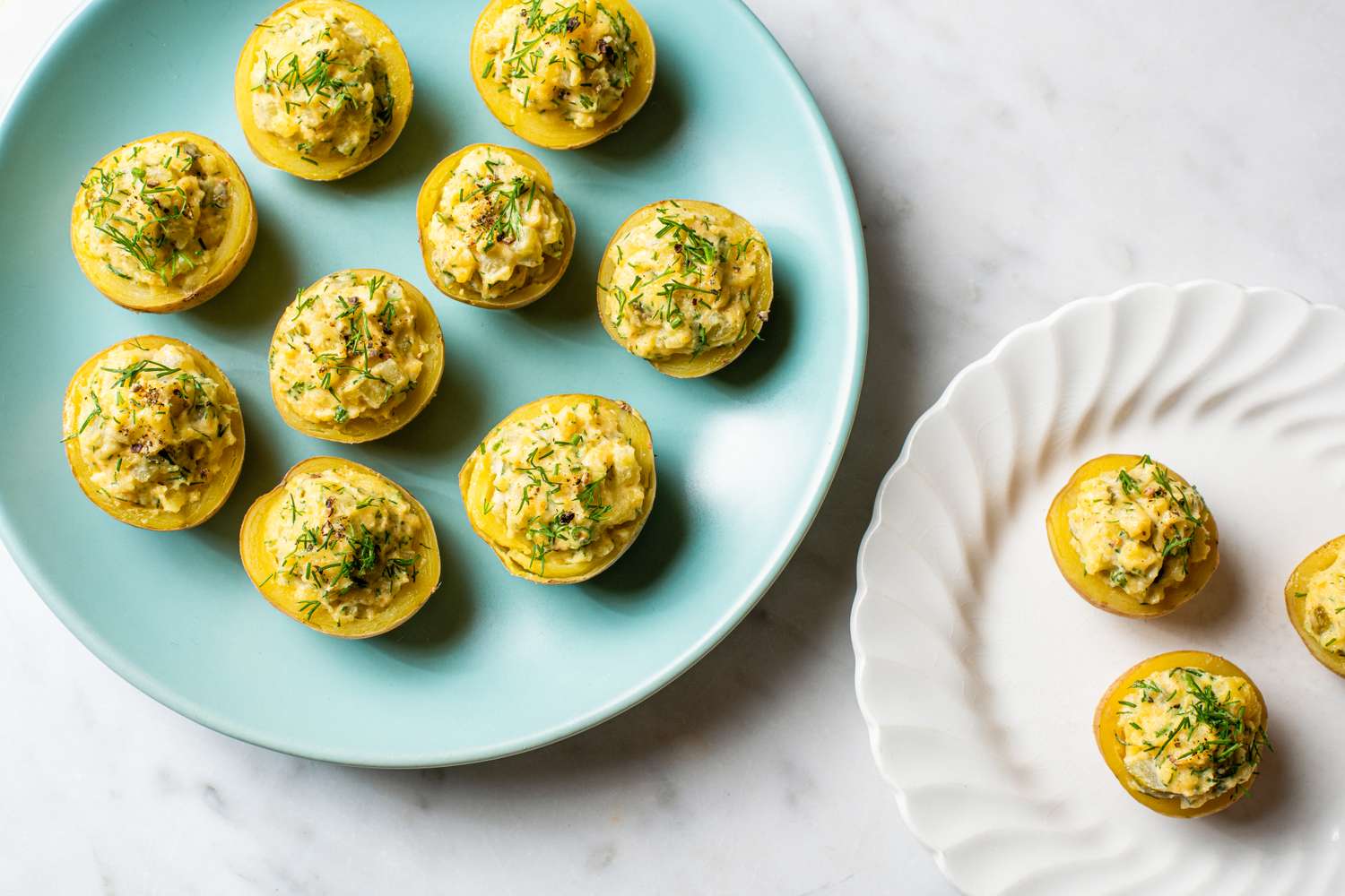 Deviled potatoes arranged on blue and white plates