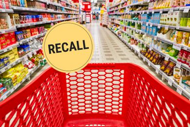 Photo of a grocery store aisle from behind a red shopping cart. A "Recall" badge is superimposed on the photo.