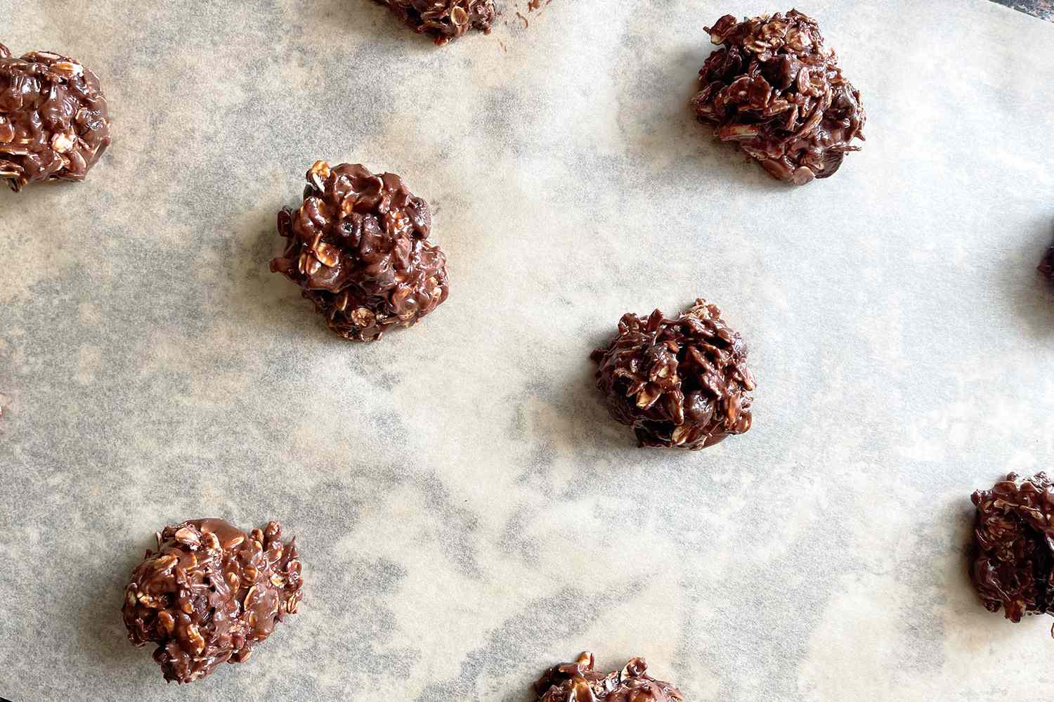Chocolate and peanut butter drop cookies on parchment paper