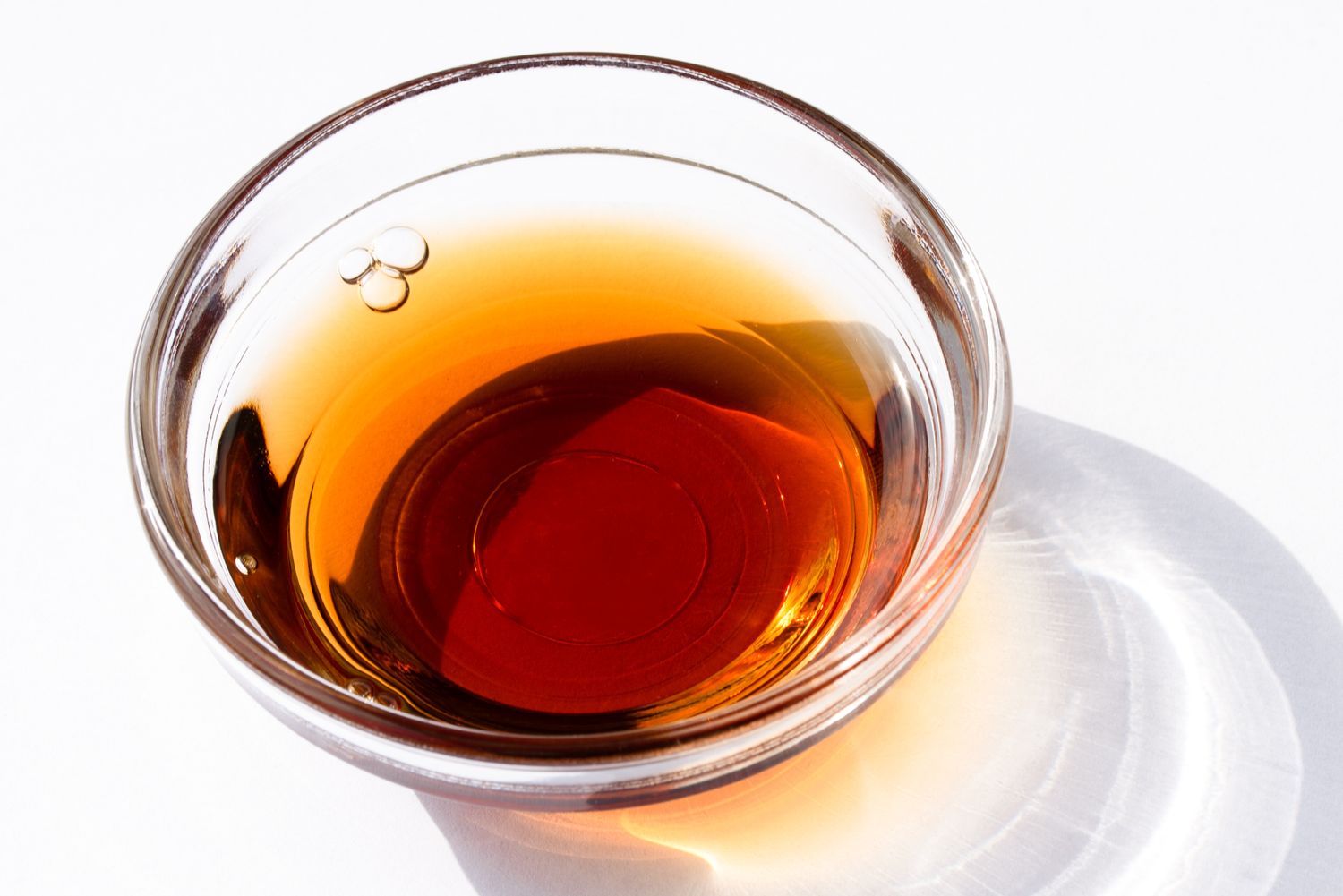 Small glass bowl containing a liquid likely meant as an ingredient in a recipe