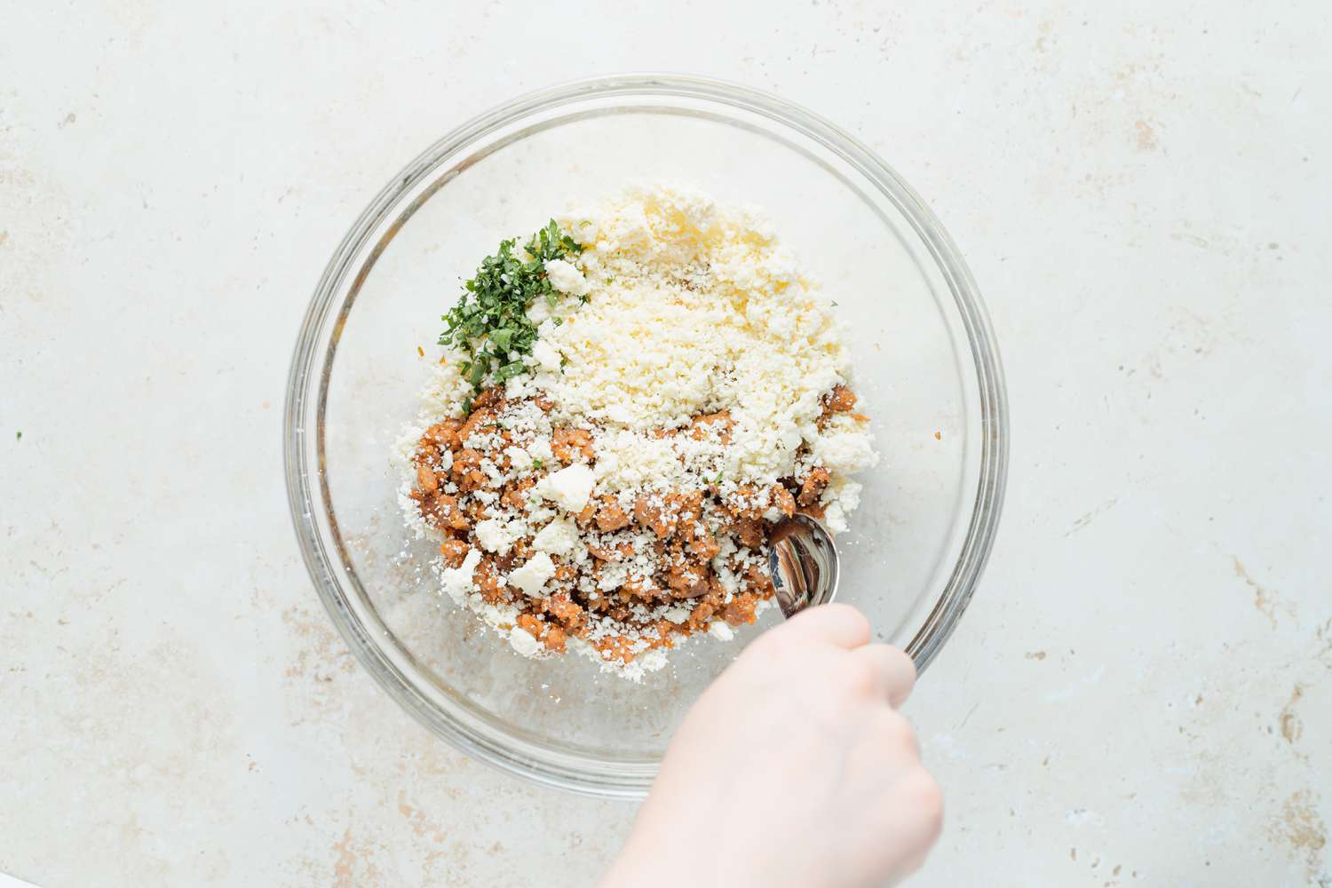 Mixing together the filling to make chili relleno casserole.