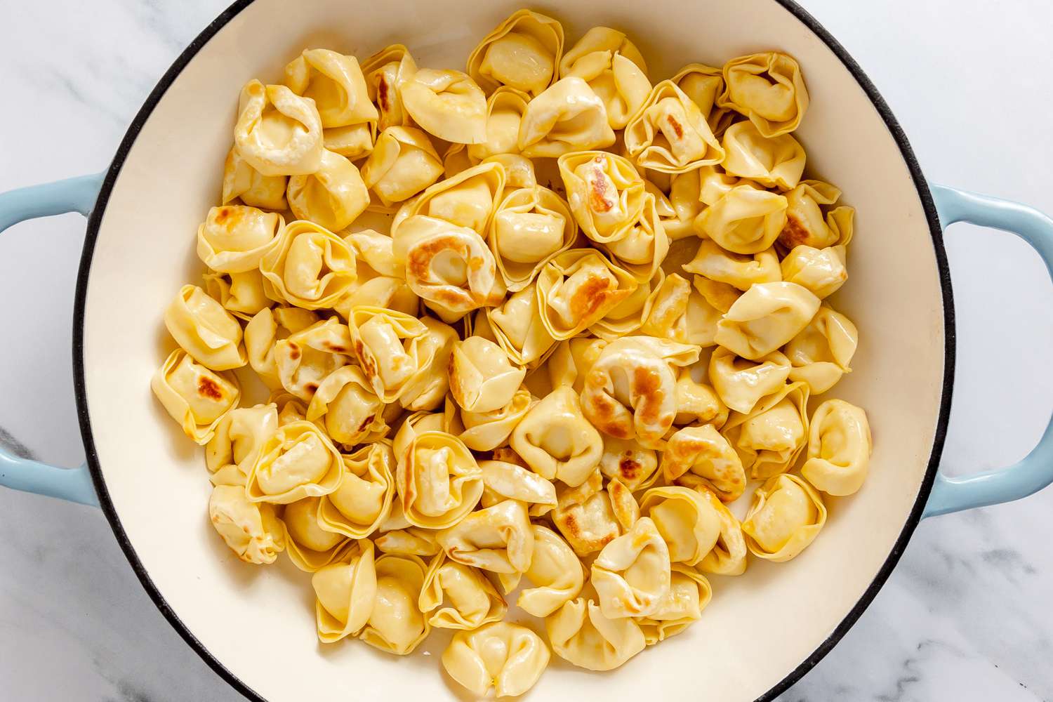 Tortellini Seared in a Dutch Oven for Skillet Cacio e Pepe Tortellini With Wilted Greens Recipe