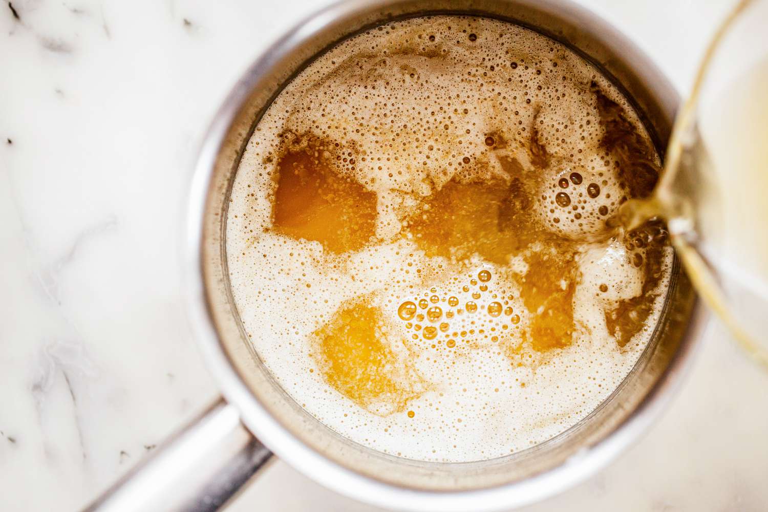 Add broth to classic velouté sauce