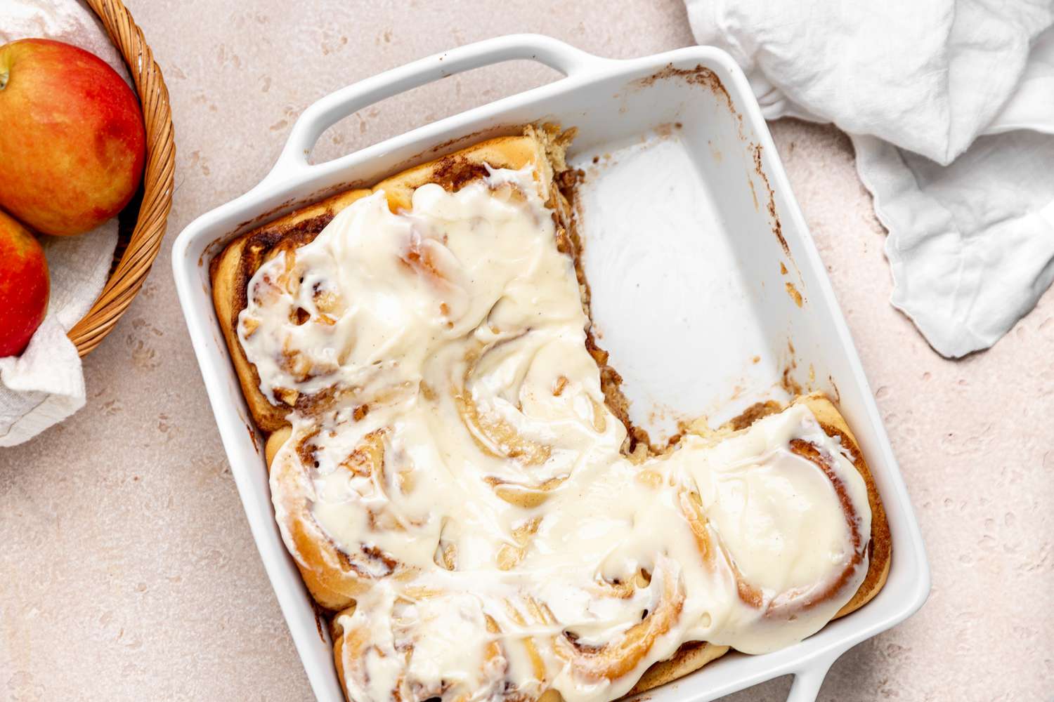 Apple Cinnamon Rolls in a Tray with a Couple Missing 
