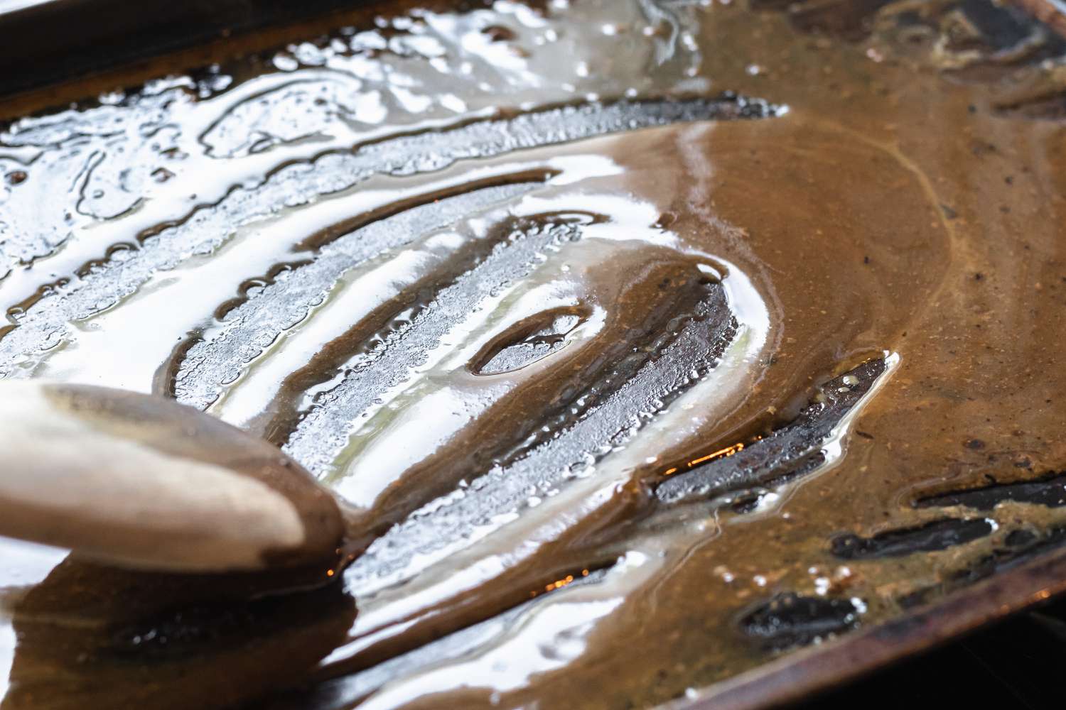 Making gravy from the drippings of a roast beef.