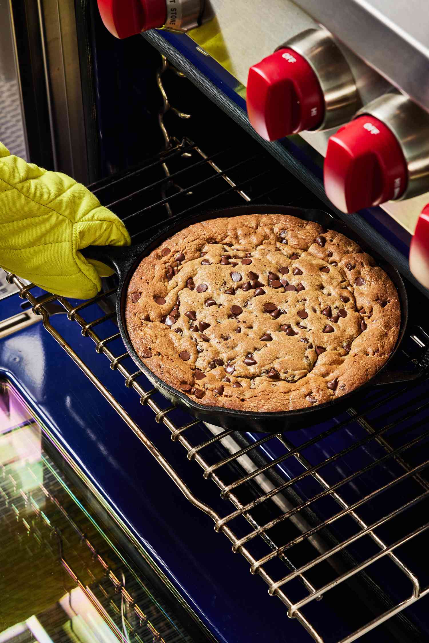 Cookie skillet being pulled from oven