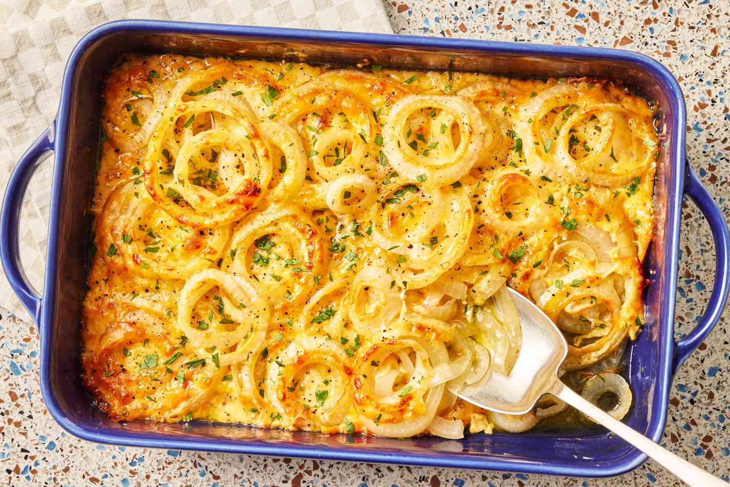 Tennessee Onions (Casserole) from above in a casserole dish with a spoon