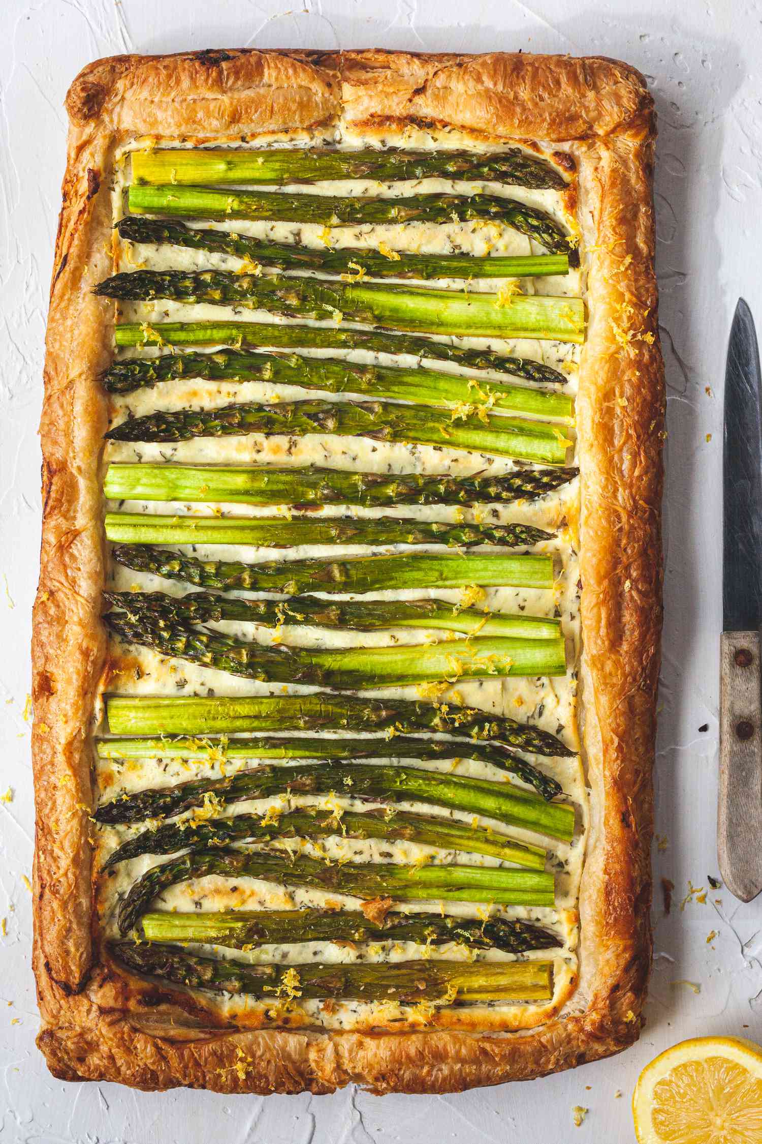Easy Asparagus and Goat Cheese Tart on a platter.