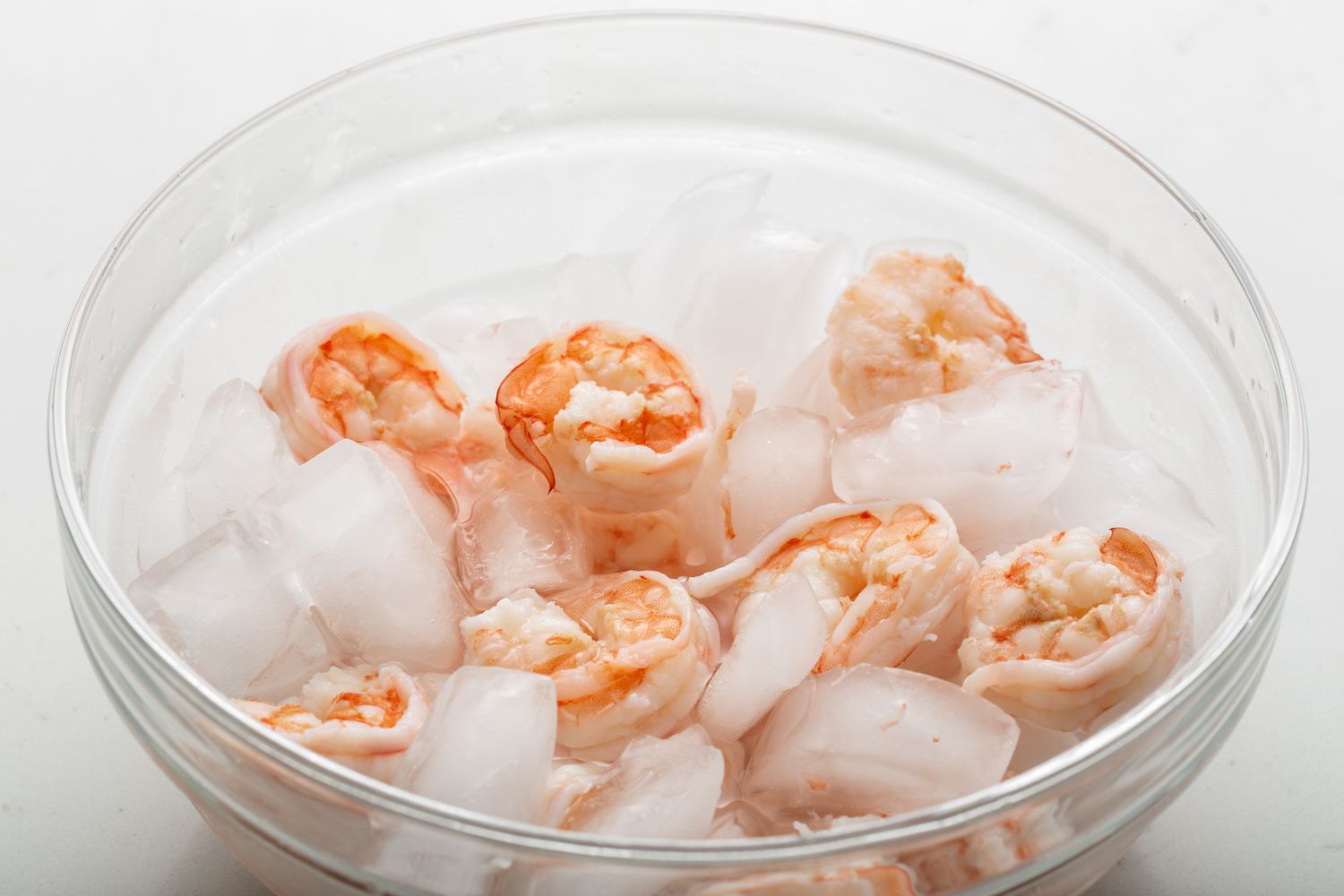 Shrimp in a bowl of ice to show how to make shrimp ceviche.