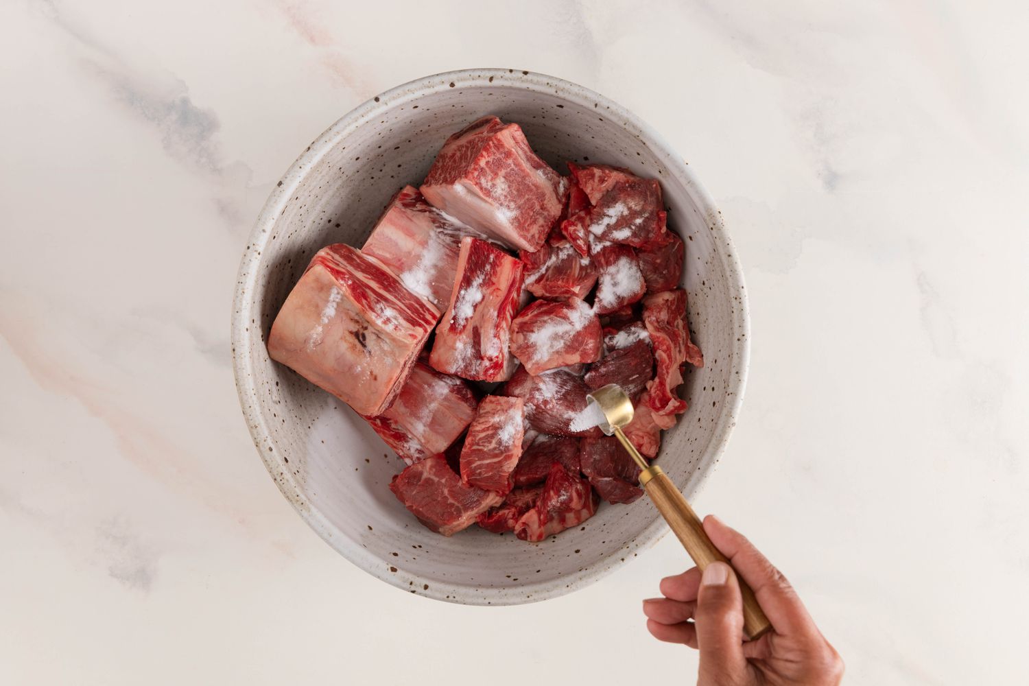 Baking soda added to a bowl of meat for nilagang baka (Filipino beef stea recipe)