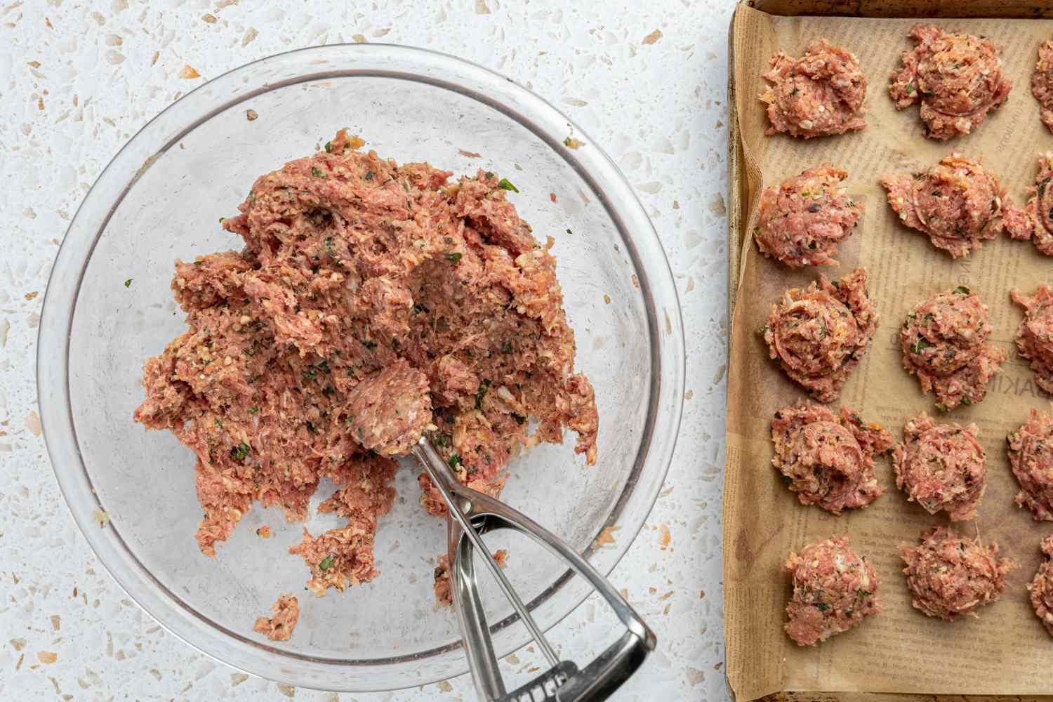 Meatballs Portioned Using a Cookie Scoop and Placed on a Parchment Wrapped Baking Tray for Spaghetti and Meatballs