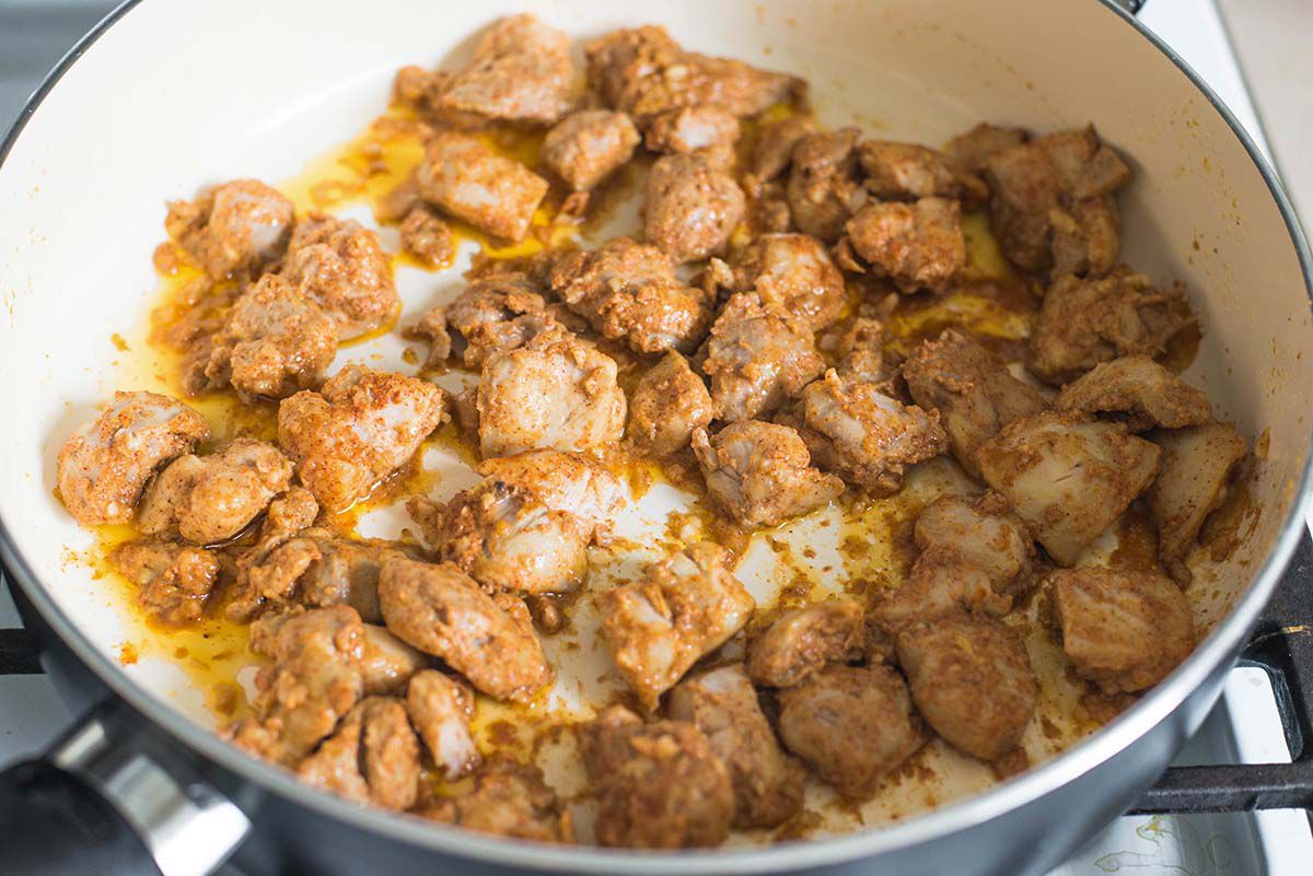 How to make chicken tikka masala at home cook until chicken is done in a pot on the stove.