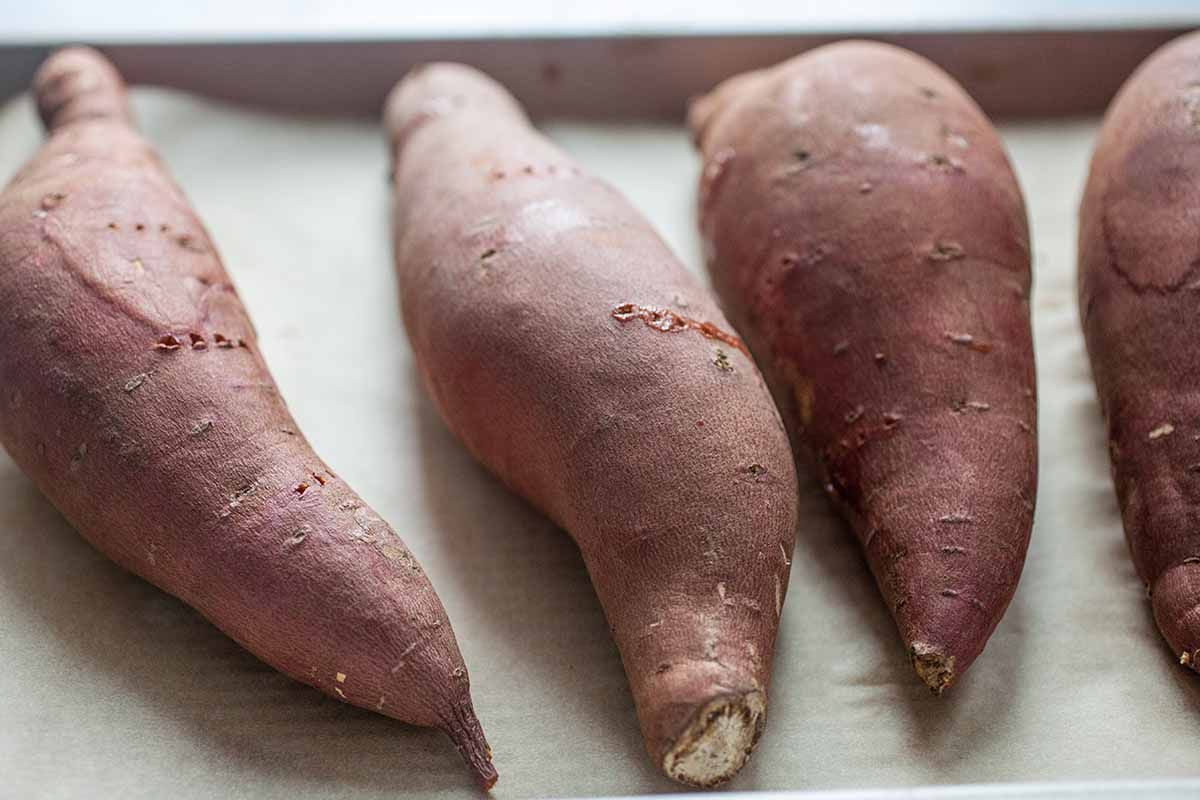 Twice Baked Sweet Potatoes with Black Beans pierce the potatoes with a fork and bake