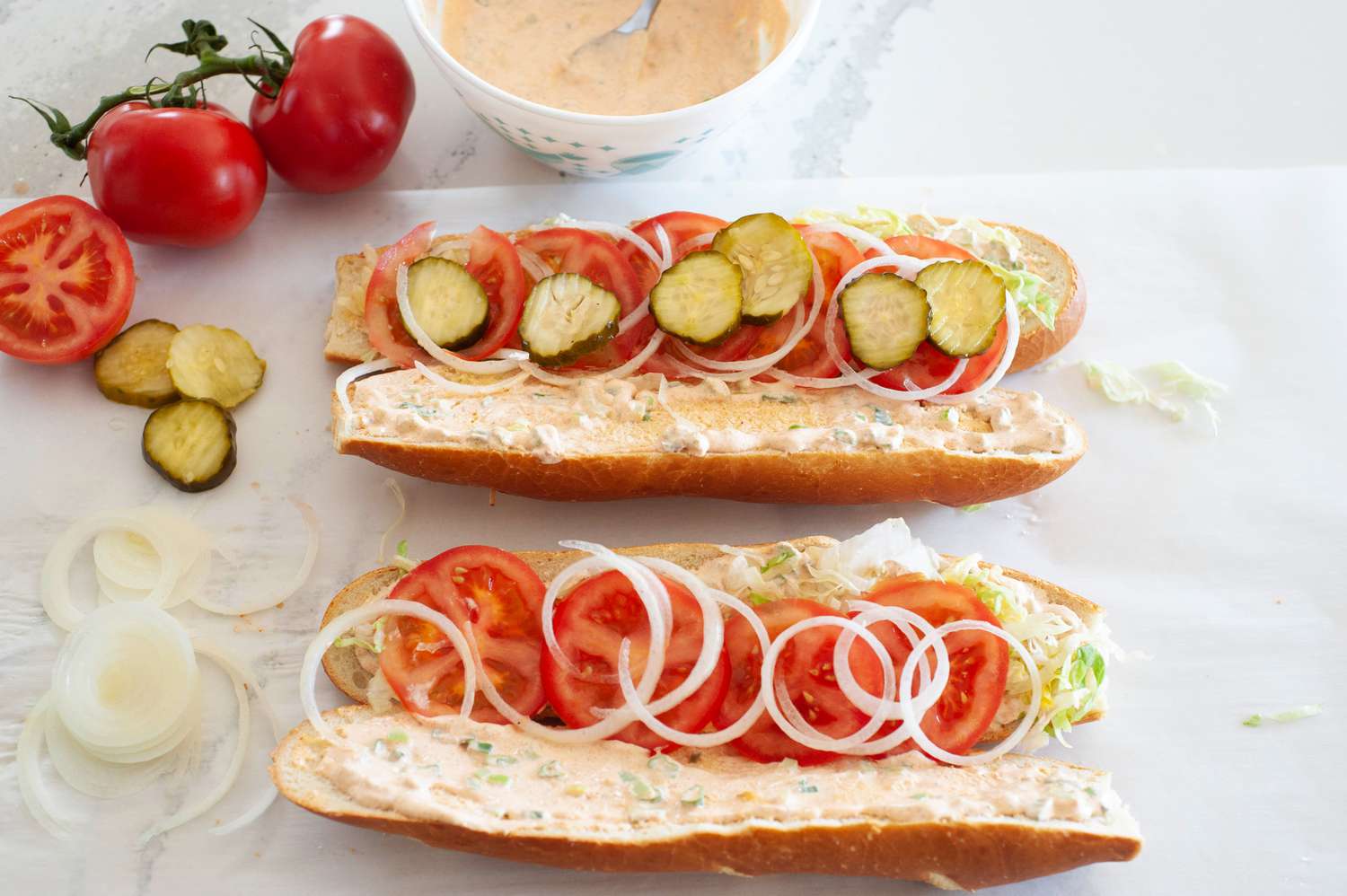 Assemble Fish Po' Boy with Tomato, Lettuce, and Onions
