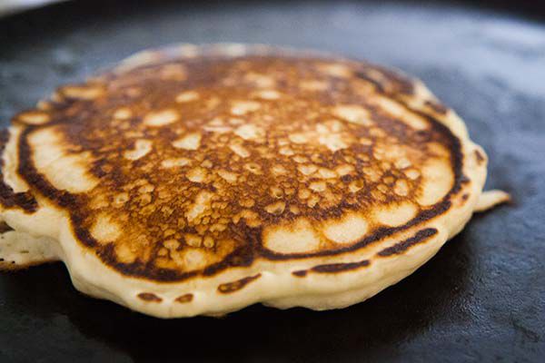 Fluffy blueberry pancakes on skillet