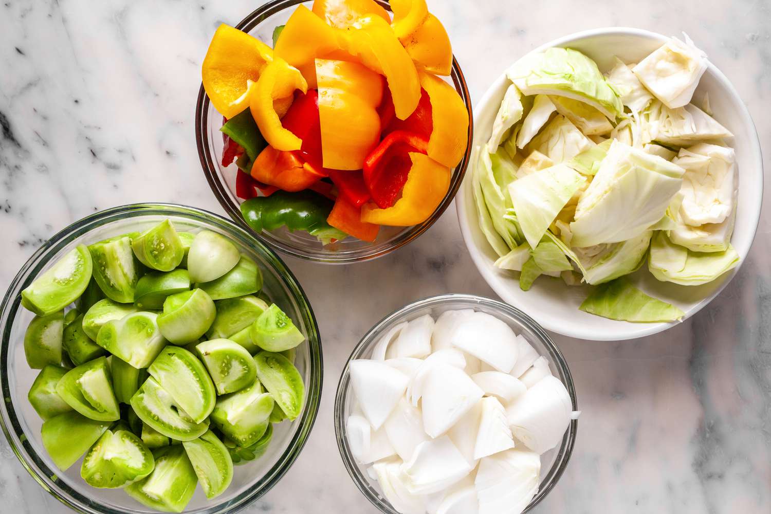 Bowls of Ingredients (Green Tomatoes, Peppers, Cabbage, and Onions) for Chow Chow 