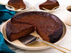 Jamaican Black Cake on a platter, slice cut