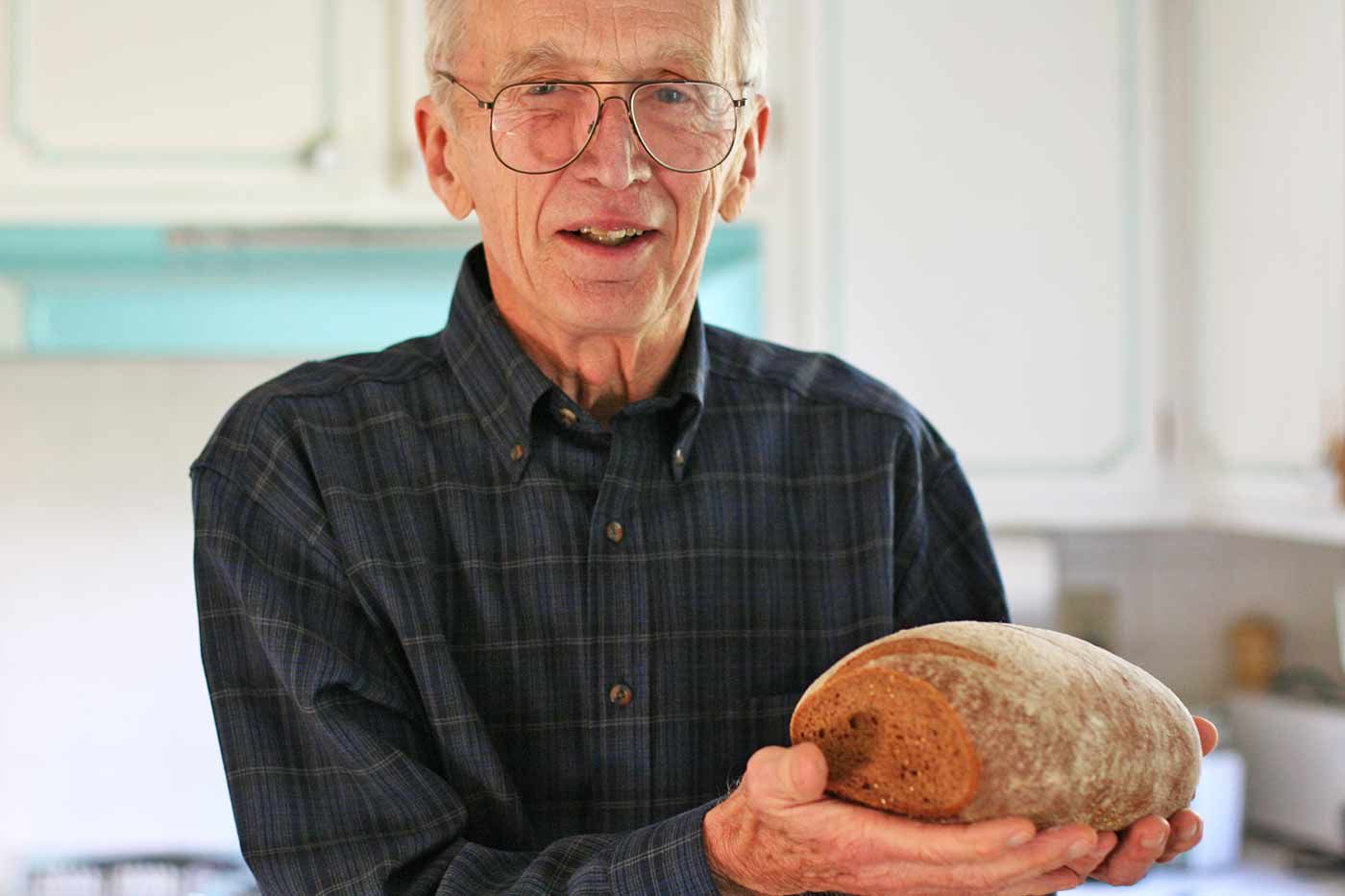 A man holding rye bread