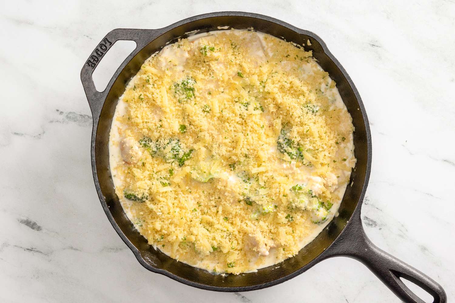 chicken divan in skillet topped with panko mixture