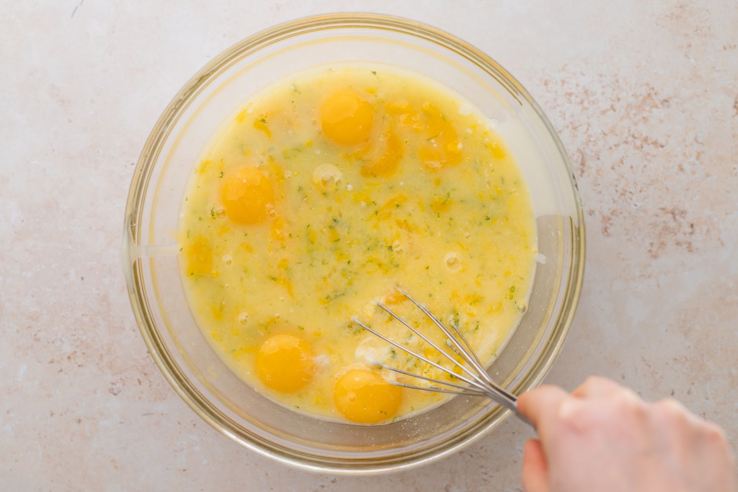 Eggs in clear bowl for key lime bar filling