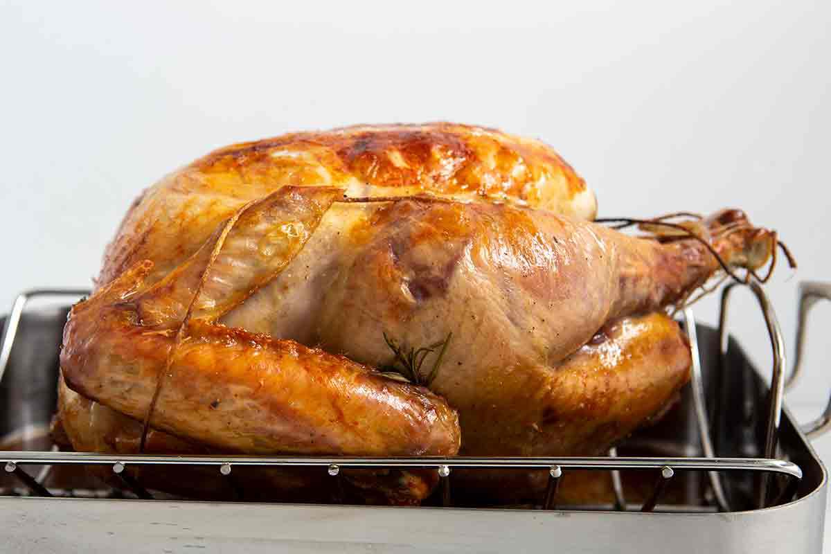 roast turkey in pan ready to be carved