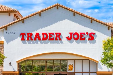 Front view of a Trader Joes storefront clear sky in the background