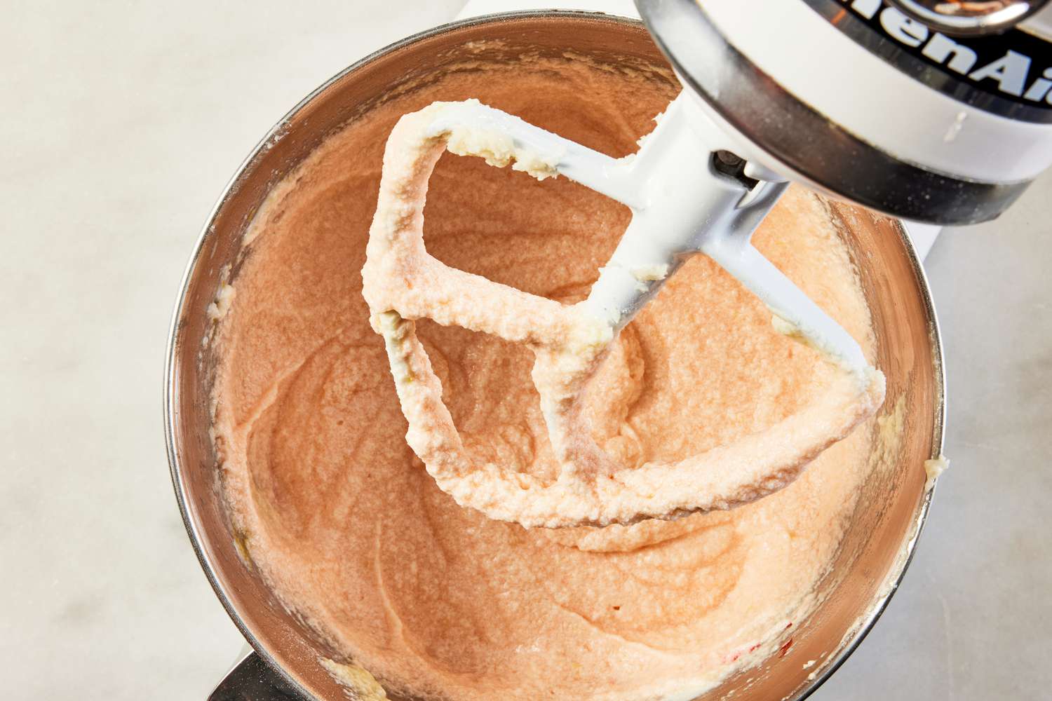 food coloring added to batter in stand mixer for pink lemonade cake recipe