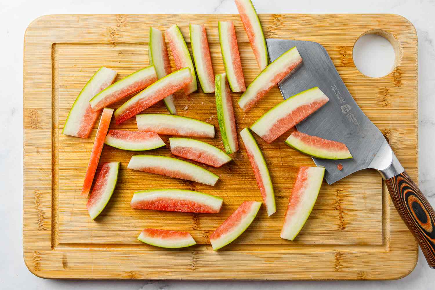 Watermelon Rinds Cut into Strips for Pickled Watermelon Rinds Recipe