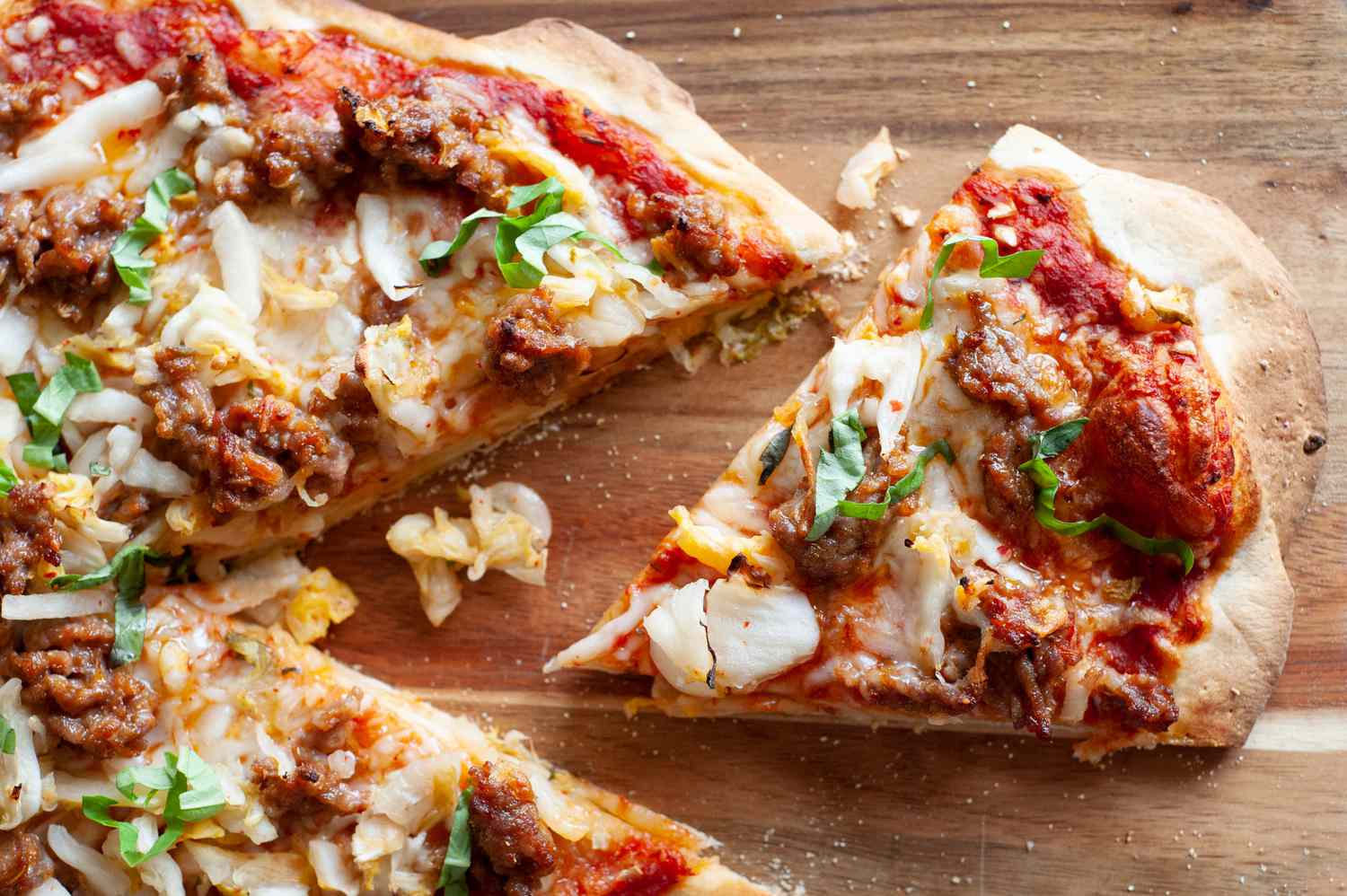 Slice of kimchi and sausage pizza.