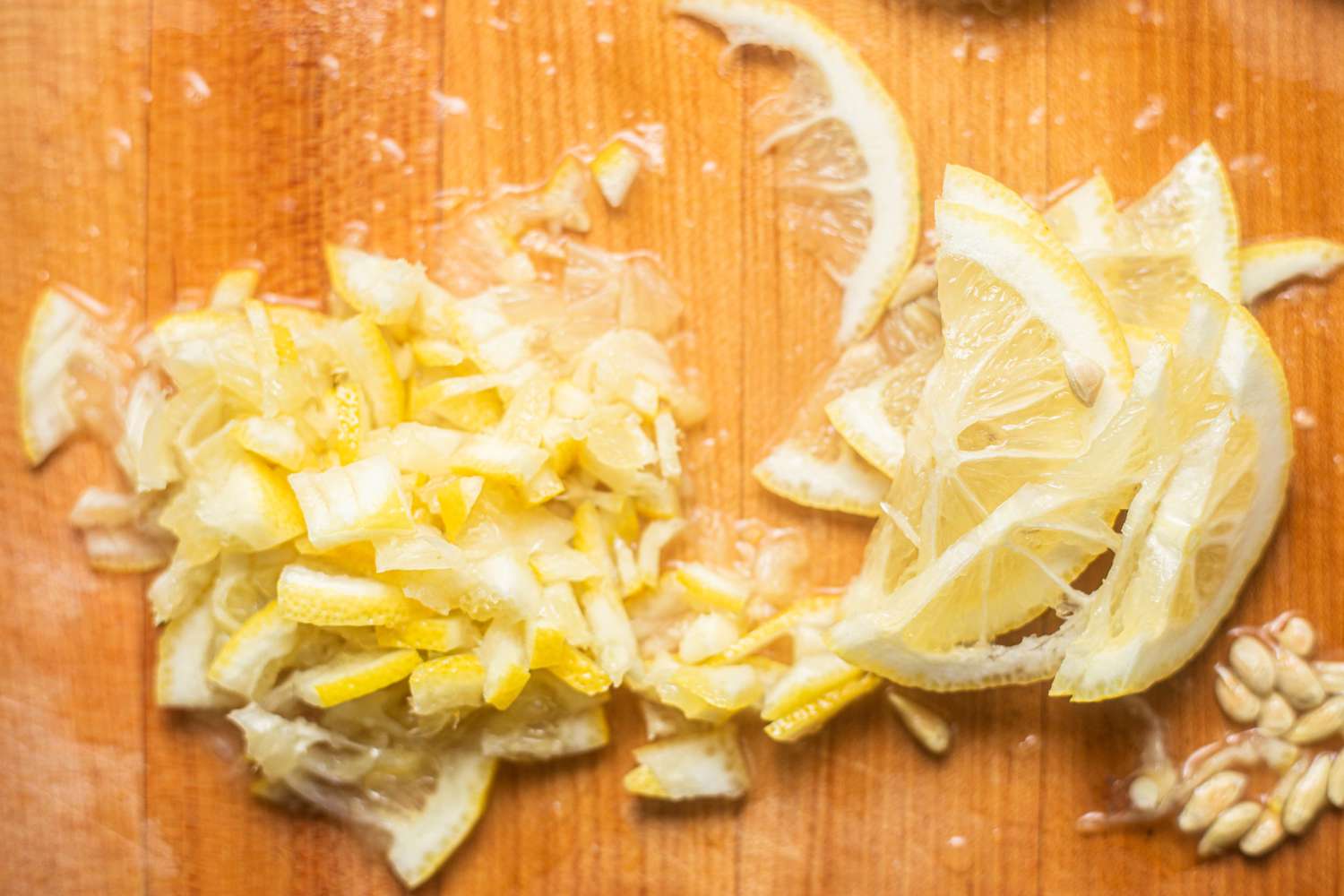 Lemon Thinly Sliced and Cut Into Small Bite Size Pieces on a Cutting Board 
